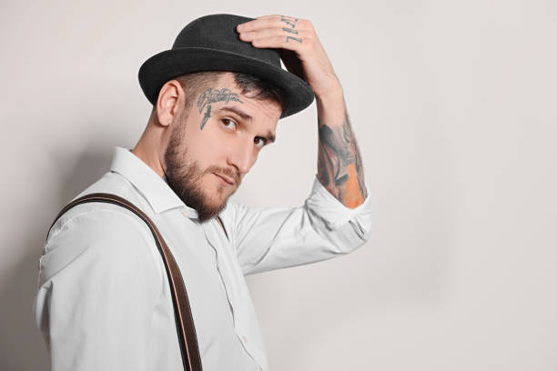 istock Portrait of handsome hipster man on light grey background. Space for text 1822918142