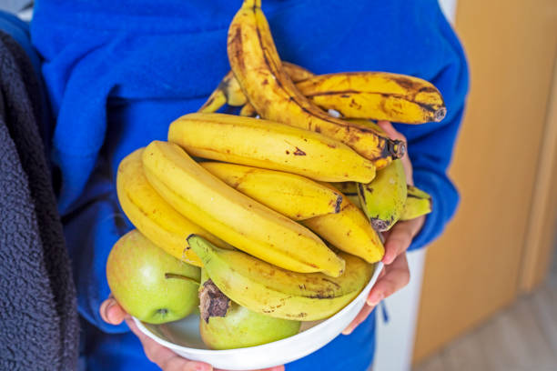 istock hold a deep bowl with bananas and apples 1822923008