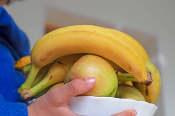 istock hold a deep bowl with bananas and apples 1822923534