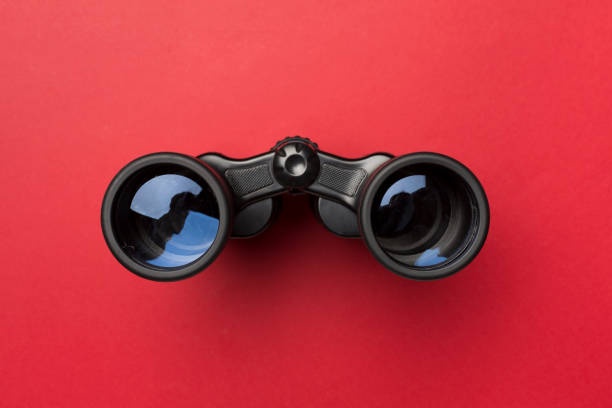 istock Black binoculars on color background. Top view 1822932569