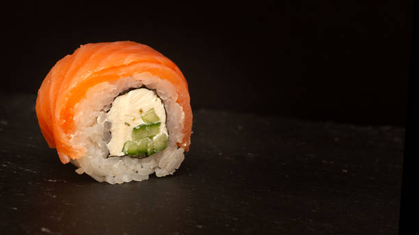 istock Sushi roll with salmon on a dark background. 1822934165
