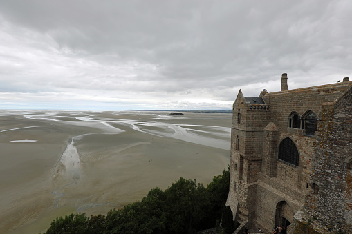 Mont Saint Michel Abbey in Northern France and panoramic view during low tide