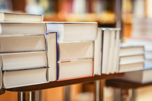 istock Many stacks of books on table in book store, library. Education, school, reading concept 1822963218