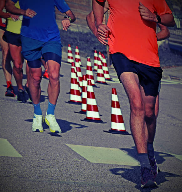 istock Legs of runners while running in the road with old toned effect 1822969636