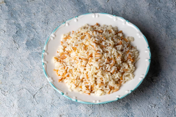 Traditional delicious Turkish food; Turkish style rice pilaf (Turkish name; Arpa sehriyeli pirinc pilavi) Traditional delicious Turkish food; Turkish style rice pilaf (Turkish name; Arpa sehriyeli pirinc pilavi) ARPA stock pictures, royalty-free photos & images