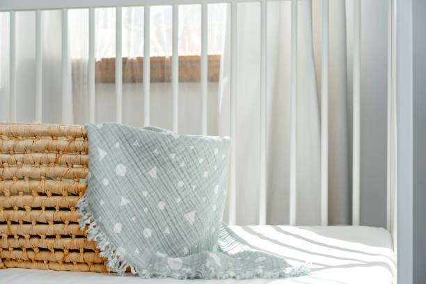 istock Nursery interior and bedding for kids with wicker bassinet 1822979637