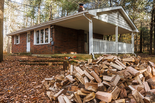 Stacked wood pieces, intended for winter, await their purpose as firewood in winter