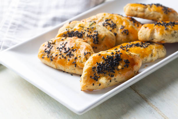 istock Turkish style pastry with olives and dill cheese pastry (Turkish name; Zeytinli pogaca ve dere otlu peynirli pogaca) 1822990294