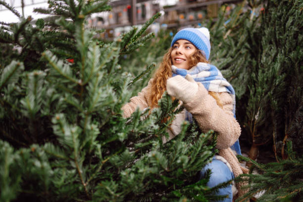 istock Happy woman buying a Christmas tree. 1822990827