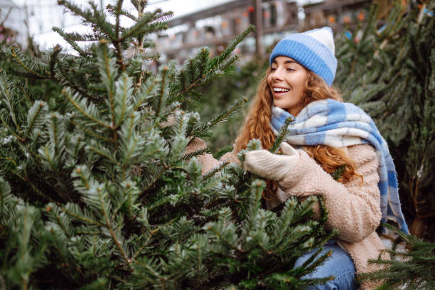 istock Happy woman buying a Christmas tree. 1822991865