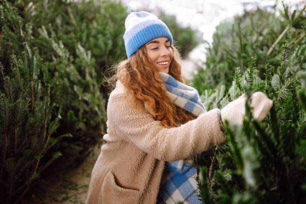 istock Happy woman buying a Christmas tree. 1822992948