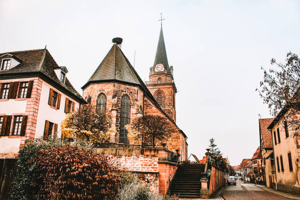 Image of the main street of the village of Bergheim with the church in one side
