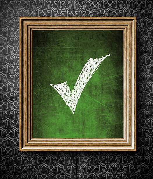 istock Check mark symbol chalkboard in old wooden frame 182301105