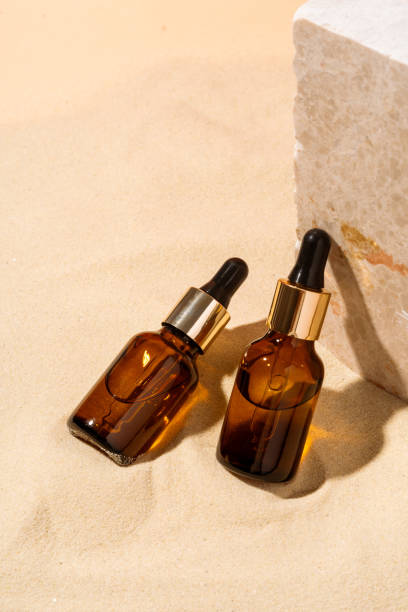 istock Essential oil glass bottle on beige background. 1823012365