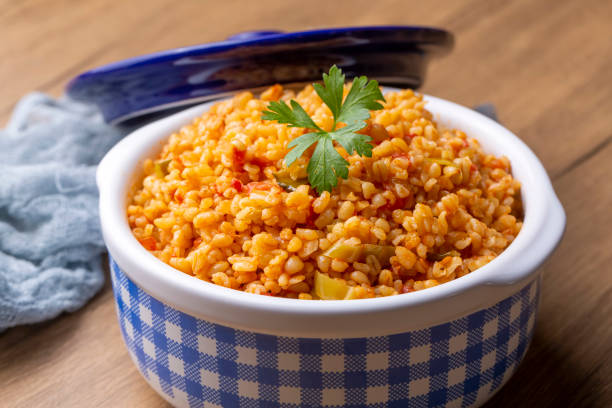 istock Traditional turkish bulgur pilaf with tomato sause in plate (Turkish name; meyhane pilavi) 1823012374