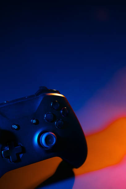 istock Gaming joystick on black background in neon light 1823014120