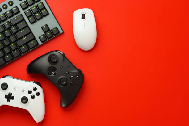 istock Gamer equipment on red background top view 1823026955
