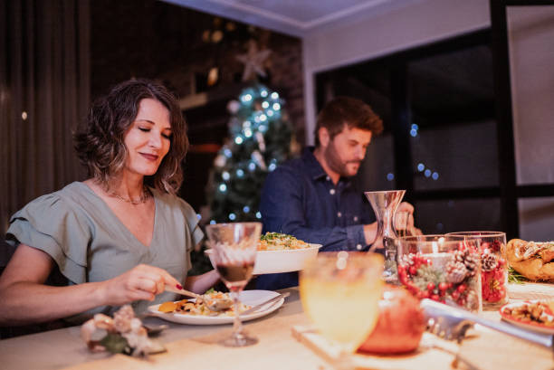 istock Mature couple eating at Christmas dinner 1823034843