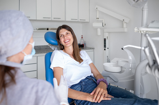 Dentist woman and patient during dental consultation - Buenos Aires - Argentina