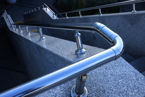Stairs in the building with metal handrail