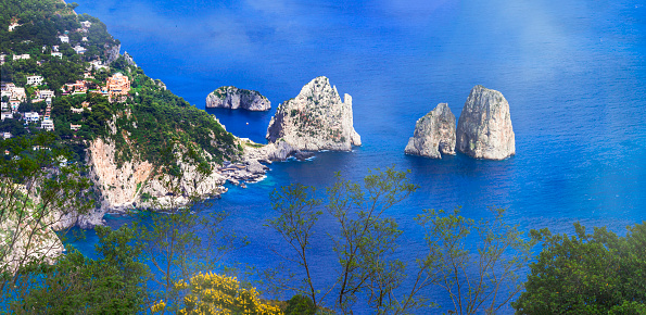 most scenic island of Italy and popular resort - beautiful Capri. panoramic view woth famous faraglioni rocks