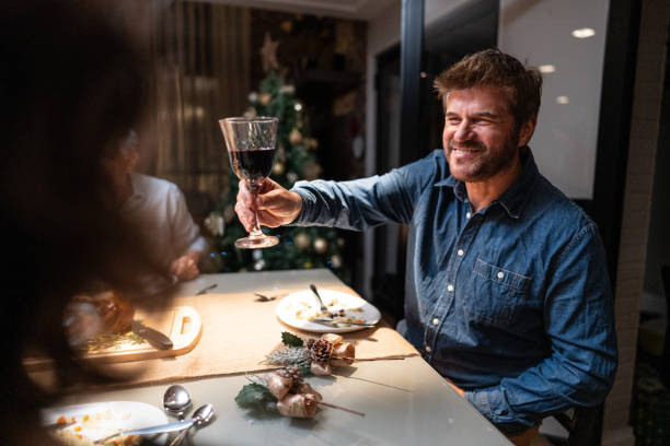 istock Mature man on celebratory toast at Christmas dinner 1823052372
