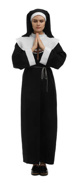 Nun with clasped hands praying to God on white background