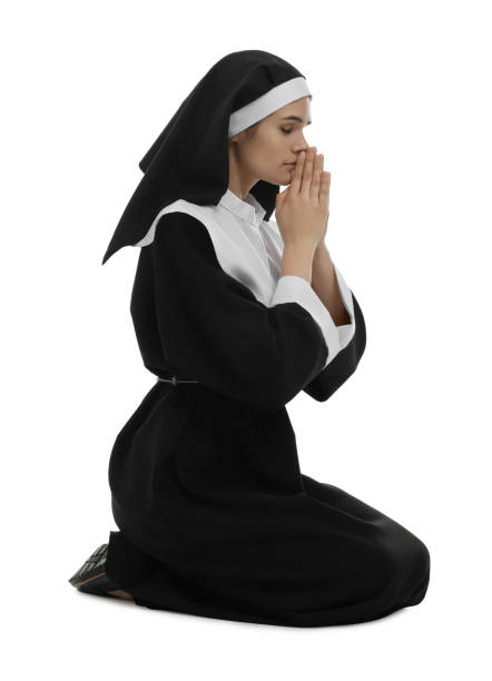 istock Nun with clasped hands praying to God on white background 1823058821