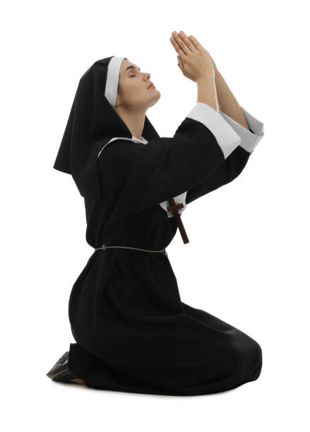 istock Nun with clasped hands praying to God on white background 1823059253