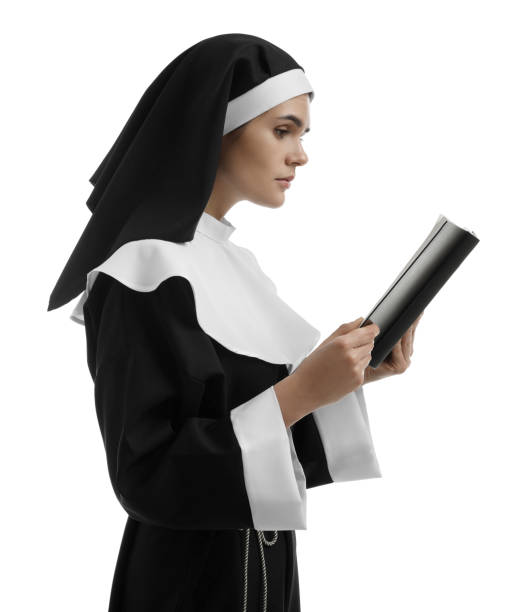 istock Young nun reading Bible on white background 1823059376