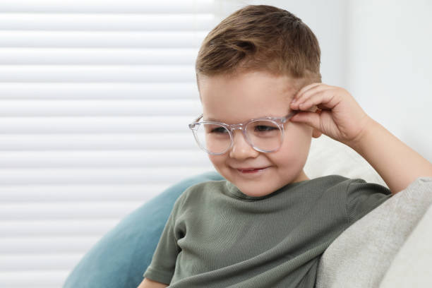 istock Cute little boy in glasses at home. Space for text 1823066326