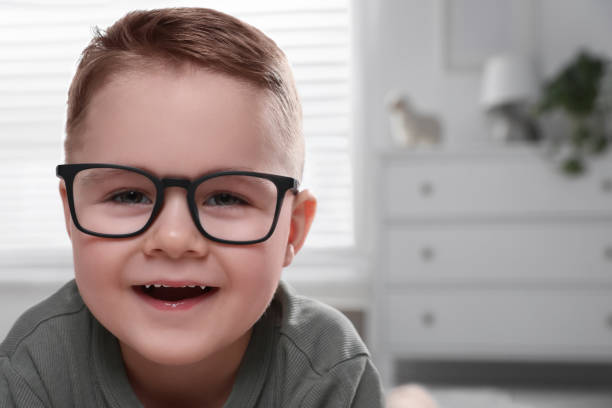 istock Cute little boy in glasses at home. Space for text 1823071498