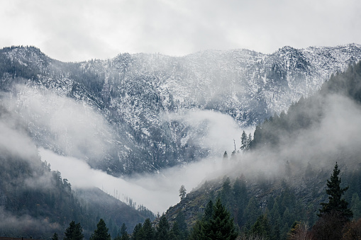 Foggy landscape of the blue side of the North Cascade Mountain Range in Washington state.