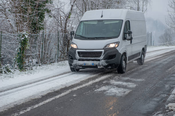 istock Delivery van on snowy road 1823115791