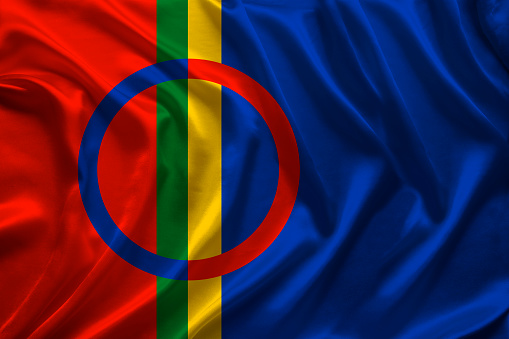 beautiful colored national flag of lapland on textured fabric, concept of tourism, emigration, economy and politics, closeup