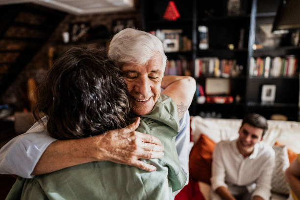 istock Senior man embracing to his daughter at home 1823168221