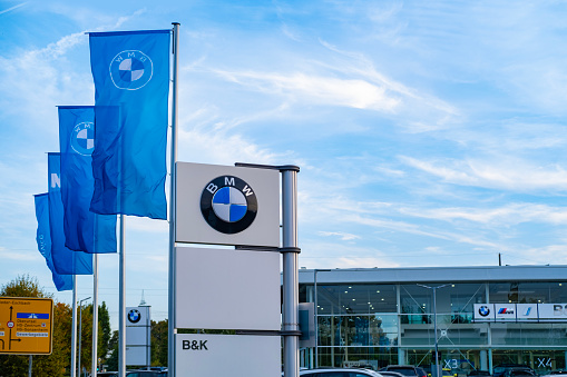 Advertising banners, flags of German concern BMW Group, Sales Office, concept Advertising and Marketing in Automotive Industry, Global Brands, Leadership and Innovations, Frankfurt - October 11, 2023