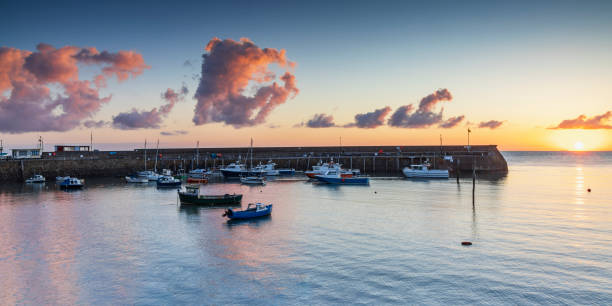 istock Sunrise over the old harbour at Minehead 1823174711