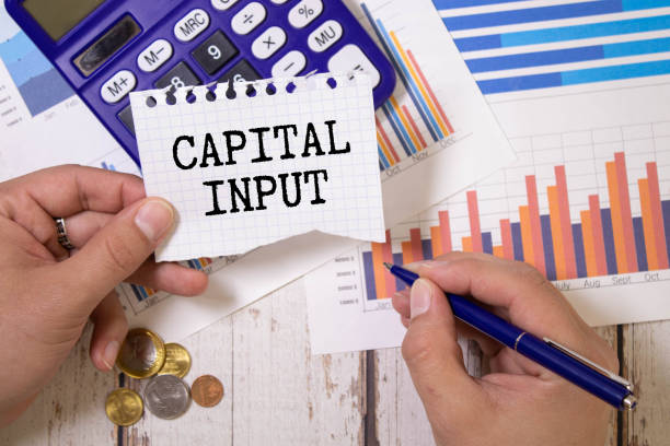 istock Gap analysis text written on a notebook. Wooden background with laptop,phone and calculator 1823194913