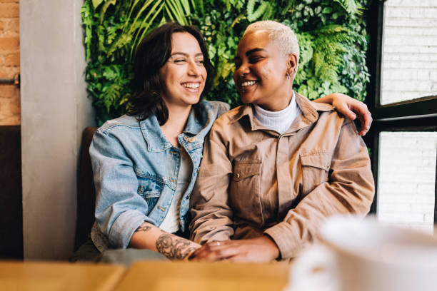 istock Lesbian couple talking at coffee shop 1823202484