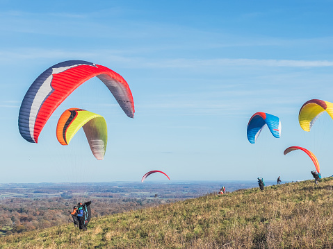 Paragliding group on outdoor, clear day, Autumn, Berkshire England, UK