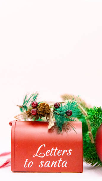 istock Santa's mailbox with fir branches on a light pink background. 1823234301