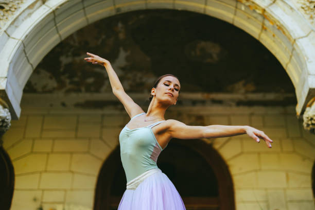 istock Beautiful ballerina dancing outside while wearing white dress 1823240152