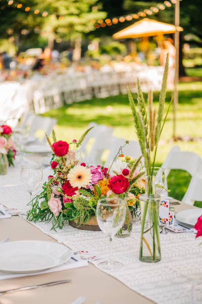 istock Bohemian Chic Celebration: Long Table Scape with Colorful Florals in a Spring Garden 1823275954