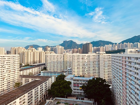 Rooftop view at the famous public housing Choi Hung Estate in Hong Kong with the mountain Lion Rock in the background