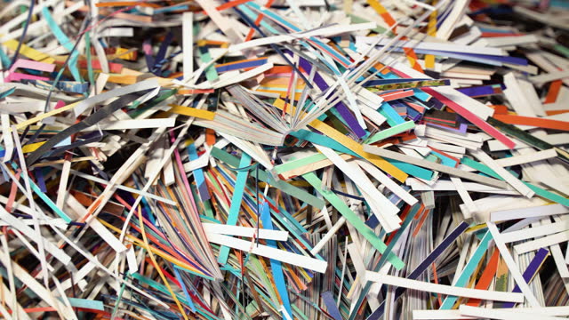Pile of shredded paper. Document shredding, identity theft and fraud concept
