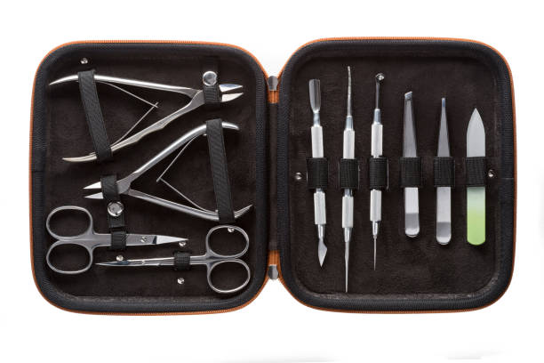istock Set of steel manicure instruments and tools in black leather case isolated on white background 1823316144