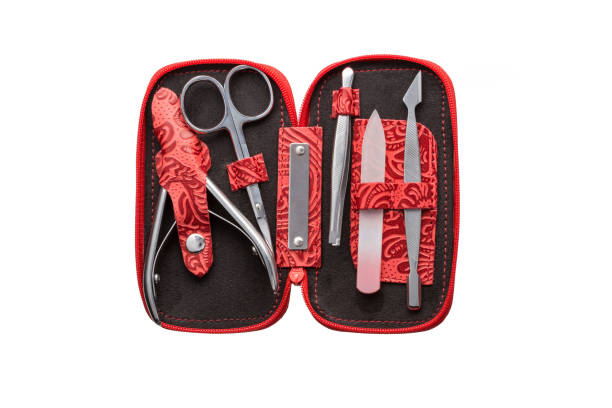 istock Set of steel manicure instruments and tools in red black leather case isolated on white background 1823316671