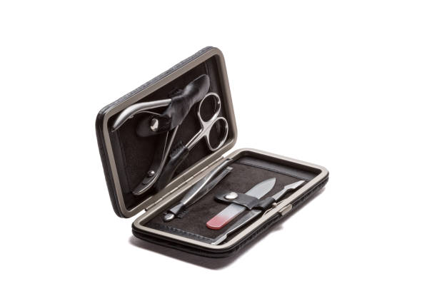 istock Set of steel manicure instruments and tools in black leather case isolated on white background 1823317632