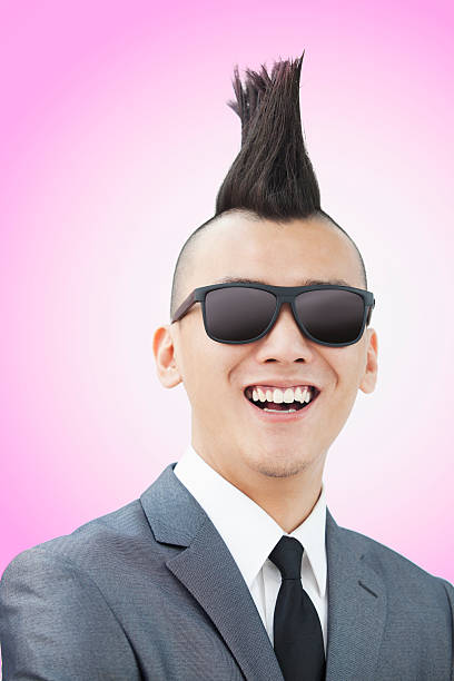 istock Well-dressed young man with Mohawk and sunglasses 182336509